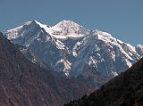 Manaslu 07 09 Shringi Himal From Kharka Near Pung-gyen Gompa From the kharka on the way from Syala to Pung-gyen Gompa, I had a perfect view of the Shringi Himal (7187m). Shringi, also known as Chamar, is an ice sheathed mountain near the Tibetan border. Shringi was climbed for the first time on June 5, 1953 by Maurice Bishop and Nyamgal Sherpa on a four person New Zealand Expedition led by Athol Roberts. Shringi South to the right is only 4m lower at 7183m.